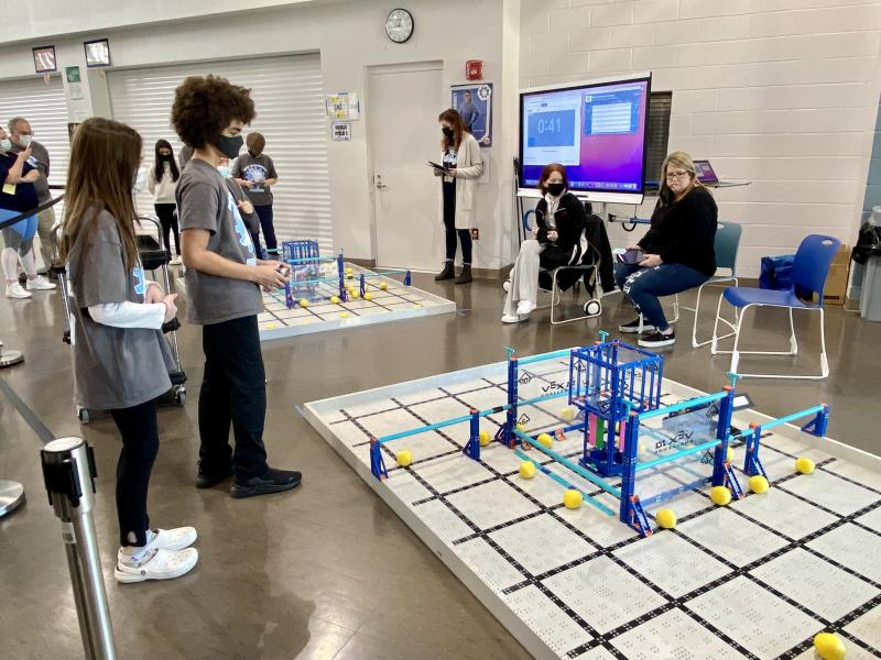 HOB students Eva Taylor and Mason Fountain participate in the skills challenge while volunteer referees Jenna Thompson, a former excellence award winner, and her mother Kim Thompson observe.